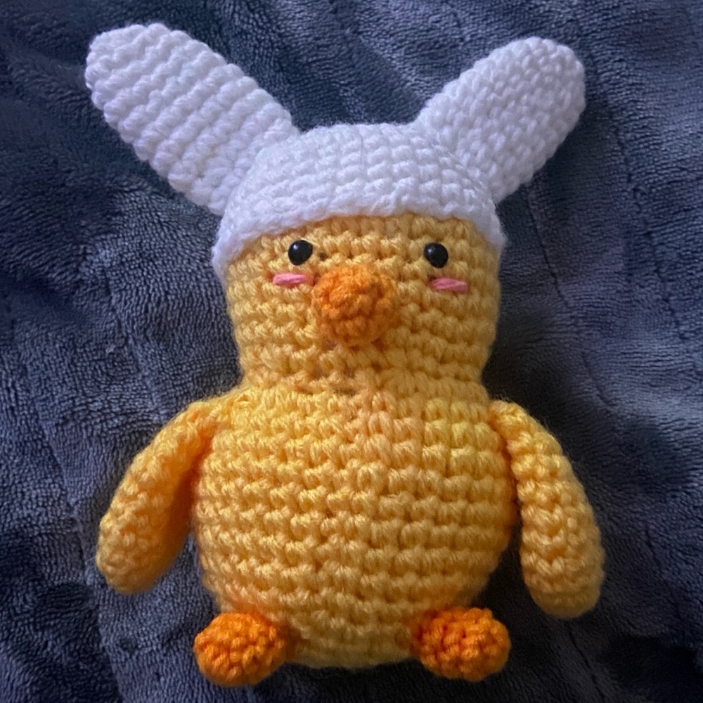 chicken, sporting a bunny hat